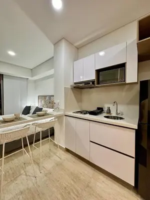 a kitchen with white cabinets and a sink at Estilo caribeño con vista al aeropuerto y cerca del mar CB1333 in Cartagena de Indias