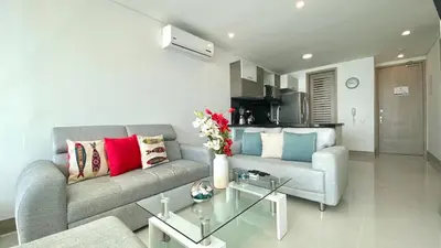 a living room with a couch and a table at Apartamento de una habitacion Palmetto Sunset 1703 in Cartagena de Indias