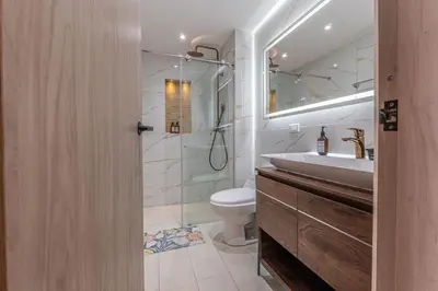 a bathroom with a shower and a sink and a toilet at CB1531 | Confort premium: cama King y balcón in Cartagena de Indias