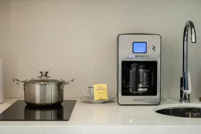 a kitchen counter with a toaster and a pot at CB937 | Stylish loft piso 9 con balcón y vista ciudad in Cartagena de Indias