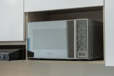 a microwave oven sitting on a shelf in a kitchen at CB937 | Stylish loft piso 9 con balcón y vista ciudad in Cartagena de Indias