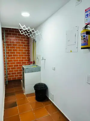 a room with a brick wall and a brick wall at Apartaestudios la terraza 1 in Sincelejo
