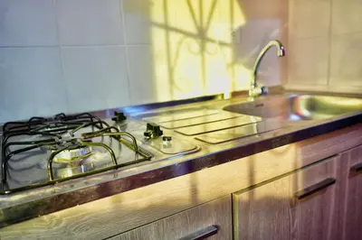 a kitchen with a stove top and a sink at Apartaestudios la terraza 1 in Sincelejo