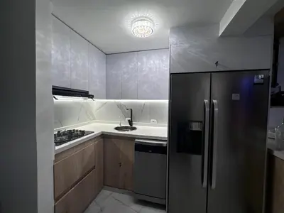 a kitchen with a stainless steel refrigerator and a sink at hermoso apto de lujo al norte alypao Deluxe in Barranquilla