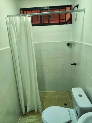 a bathroom with a toilet and a shower at Apartaestudios la terraza 2 in Sincelejo