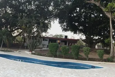 a swimming pool in front of a house at campestre, naturaleza, confort, familiar in Turbaco