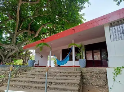 a house with stairs and a red roof at campestre, naturaleza, confort, familiar in Turbaco
