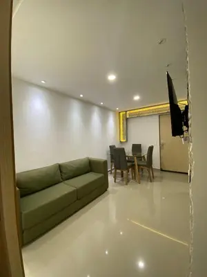 a living room with a couch and a table at Apto para vacaciones en familia in Cartagena de Indias