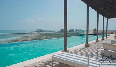 a swimming pool with a view of the ocean at OD805 Acogedor Vista al Mar Piscina Vista Infinita in Cartagena de Indias