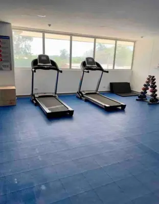 an empty gym with two treadmills in a room at OD805 Acogedor Vista al Mar Piscina Vista Infinita in Cartagena de Indias