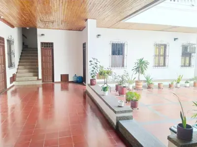 a large room with potted plants and a wooden ceiling at Apartamento centro historico 209 in Cartagena de Indias
