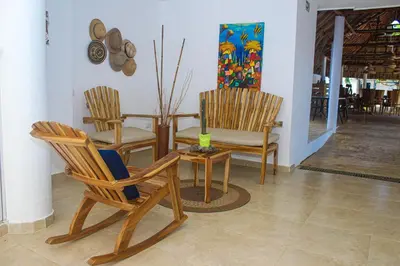 a dining room with two chairs and a table at Ledymar Chalet in Cartagena de Indias