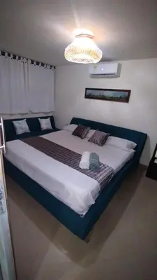 a bedroom with a large bed in a room at Hermoso apartamento en Cartagena El laguito in Cartagena de Indias