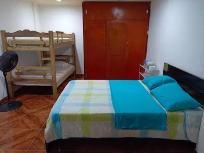a bedroom with a bed and a bunk bed at Apartamento Familiar para 6 personas in Cartagena de Indias