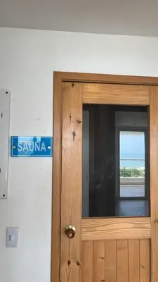 a wooden door in a room with a street sign at Aparta suite Fantástique in Cartagena de Indias