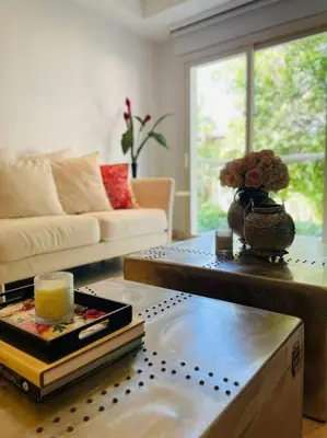 a living room with a couch and a coffee table at Modern Comfort - Spacious 2BR in Walled City in Cartagena de Indias