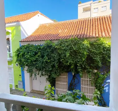 a house with a bunch of ivy growing on it at Apartaestudio in Old City Cartagena apto 2C in Cartagena de Indias