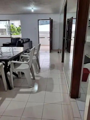 a dining room with a table and chairs at Apartamento para Vacaciones in Cartagena de Indias