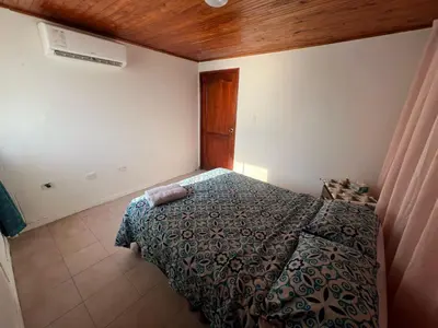 a bedroom with a bed in the corner of a room at Cartagena Mar 4You in Cartagena de Indias