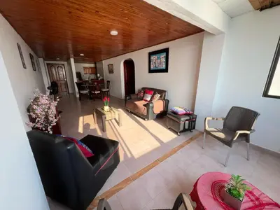 a living room with a couch and chairs and a table at Cartagena Mar 4You in Cartagena de Indias