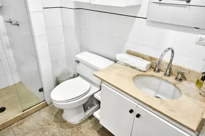 a bathroom with a toilet and a sink and a shower at Ocean Luxe Morros in Cartagena de Indias
