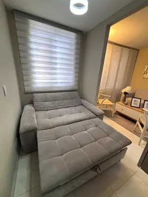 a large bed in a room with a window at Apartamento en Alameda Barranquilla in Barranquilla