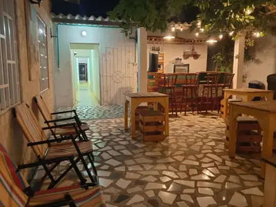 a room with chairs and a table in a room at Hotel Casa Confort Cartagena in Cartagena de Indias