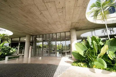a lobby of a building with a bunch of plants at U-GO Morros EOS Lujo Frente al Mar en Serena del Mar in Cartagena de Indias