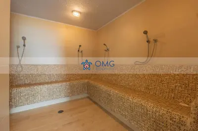 a bathroom with a large tub with tiles on the wall at CB1242 | Estudio moderno con diseño natural y piscina in Cartagena de Indias