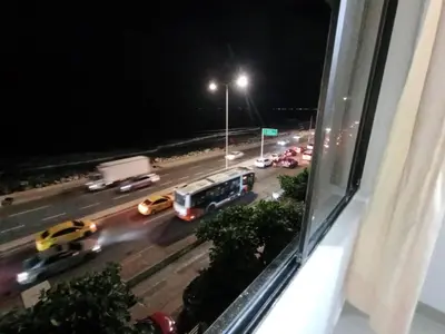 a view of a city street at night from a window at Apto Marbella in Cartagena de Indias