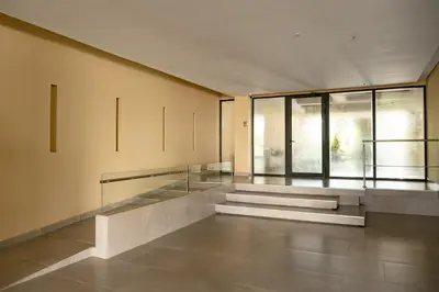 an empty room with stairs and windows in a building at Luxury Oceanfront Apartment in Cartagena Centro in Cartagena de Indias