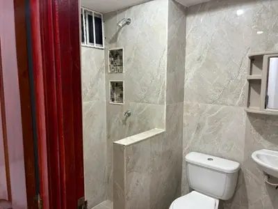 a bathroom with a shower and a toilet and a sink at Sol Serena in Soledad