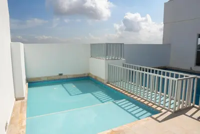 a swimming pool on the side of a building at Vista panoramica al Mar y Piscina in Cartagena de Indias
