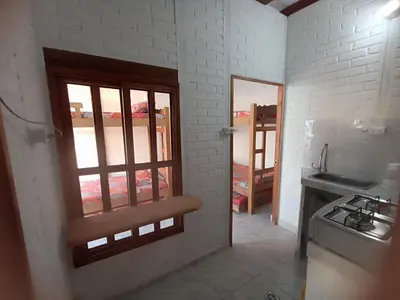 a kitchen with a sink and a window in a room at Hostal Playa Descalzo in Cartagena de Indias
