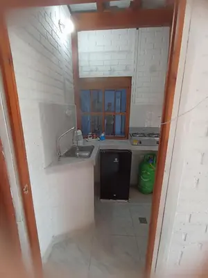 a kitchen with a sink and a counter top at Hostal Playa Descalzo in Cartagena de Indias