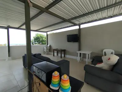 a living room with two couches and a tv at CasaNegreteHostalBoutique in Cartagena de Indias