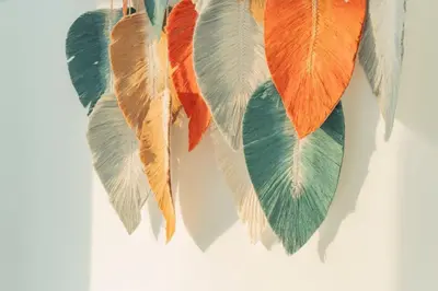 a group of feathers hanging on a wall at Oceanfront studio + sunset views CB1403 in Cartagena de Indias