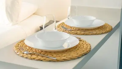 two wicker tables with bowls and cups on them at Oceanfront studio + sunset views CB1403 in Cartagena de Indias