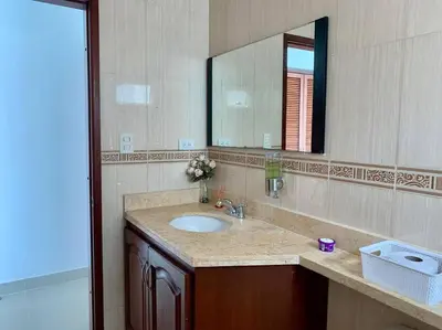 a bathroom with a sink and a mirror at Tu Pent-House Con Vista al Mar! in Cartagena de Indias