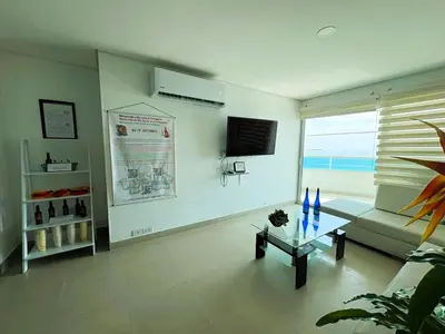 a living room with a couch and a table at Tu Pent-House Con Vista al Mar! in Cartagena de Indias