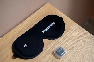 a black item on a wooden table with a device at San Martin by Wynwood House in Cartagena de Indias