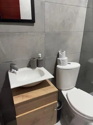 a bathroom with a sink and a toilet at Apartamentos el mochilero frente a la playa piso 1 apto 1 in Cartagena de Indias