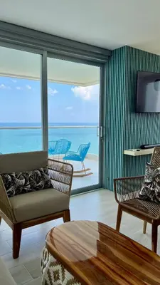 a living room with a view of the ocean at Apartamento Torre Vela- Coveñas in Coveñas