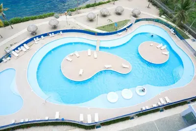 an overhead view of a swimming pool at a resort at Magico Apartamento Frente al Mar 3 Habitaciones PAZ282 in Coveñas