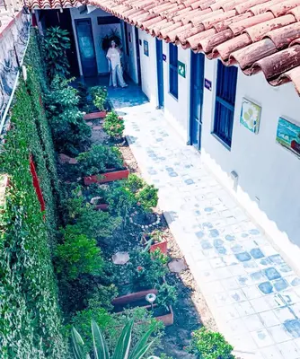 a woman standing in the doorway of a building at Zana Hotel Boutique in Cartagena de Indias