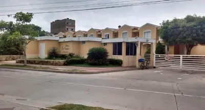 a row of houses on the side of a street at Habitación Colibrí in Barranquilla