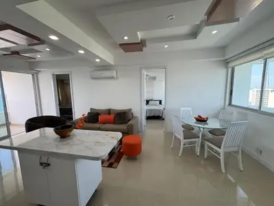 a living room with a couch and a table at Apto Luxury cartagena 2401 Palmetto1 Frente al Mar in Cartagena de Indias