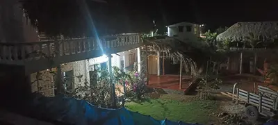 a house at night with the light shining on it at Cabaña Flor de Loto in San Bernardo del Viento