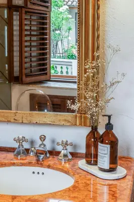 a bathroom counter with a sink and a mirror at Casa Trujillo in Cartagena de Indias
