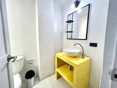 a bathroom with a sink and a mirror at Lovely Duplex with balcony! in Cartagena de Indias